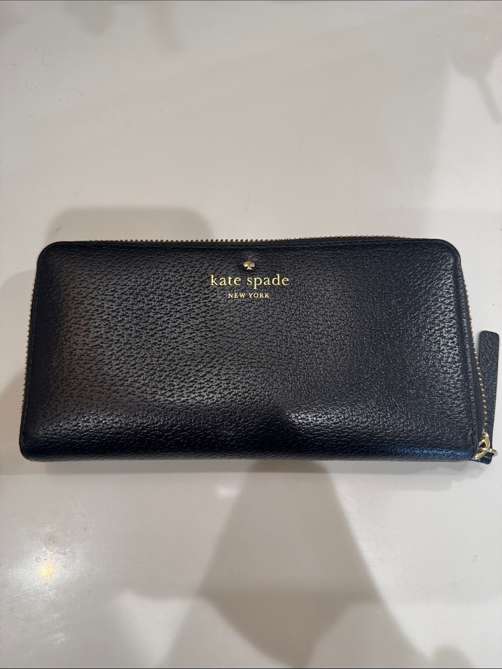 kate spade black pebbled leather zip wallet with gold logo